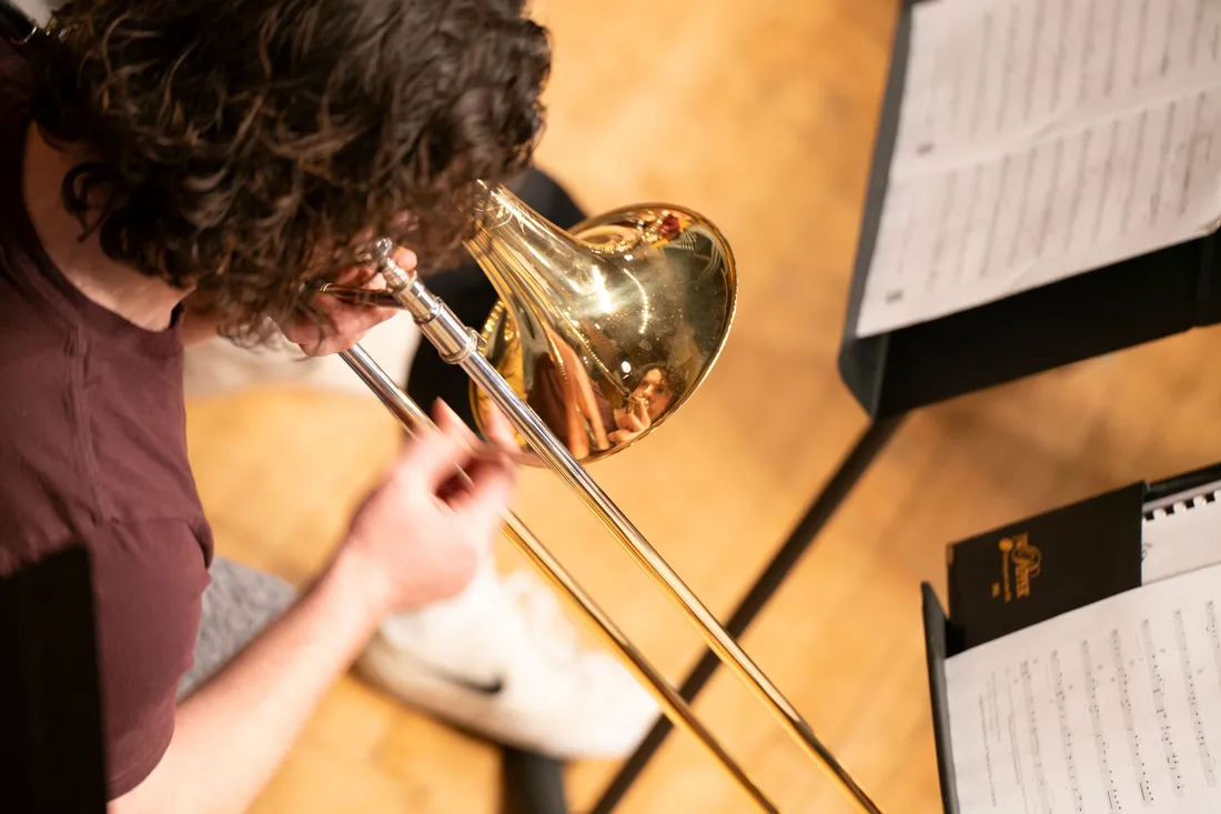 A person playing a trombone.