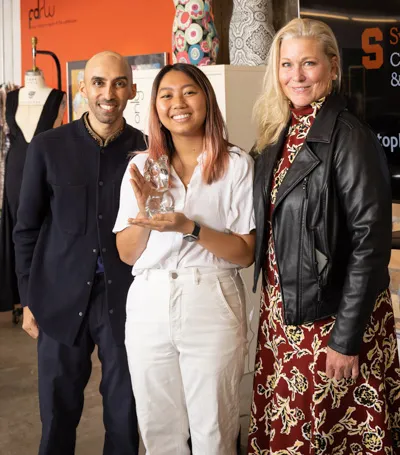 Zahir Babvani, Nina Chen and Emme standing and smiling together.