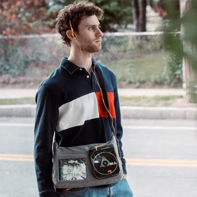 Dan Cohen walks down the street, listening to music.