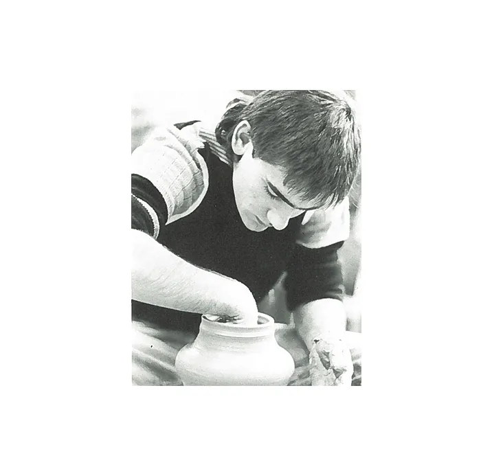 A student in a ceramics studio.
