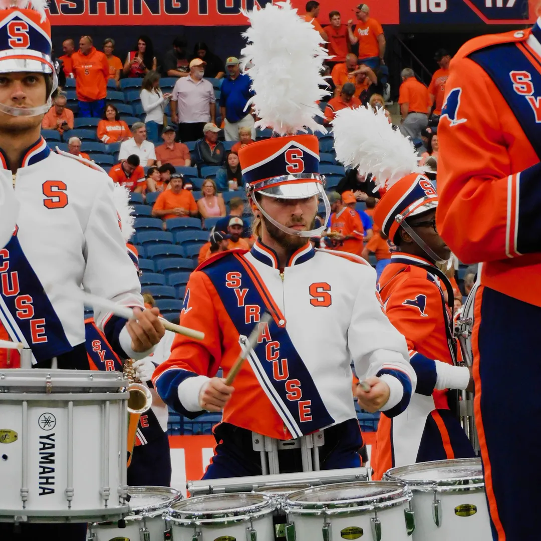 A person plays the drums.