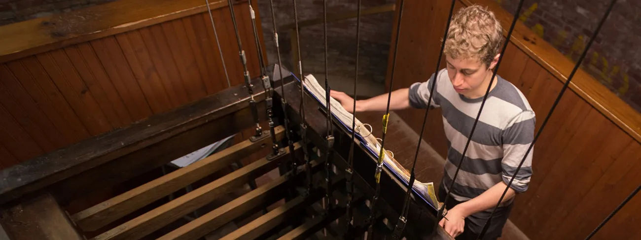 A student plays chimes.