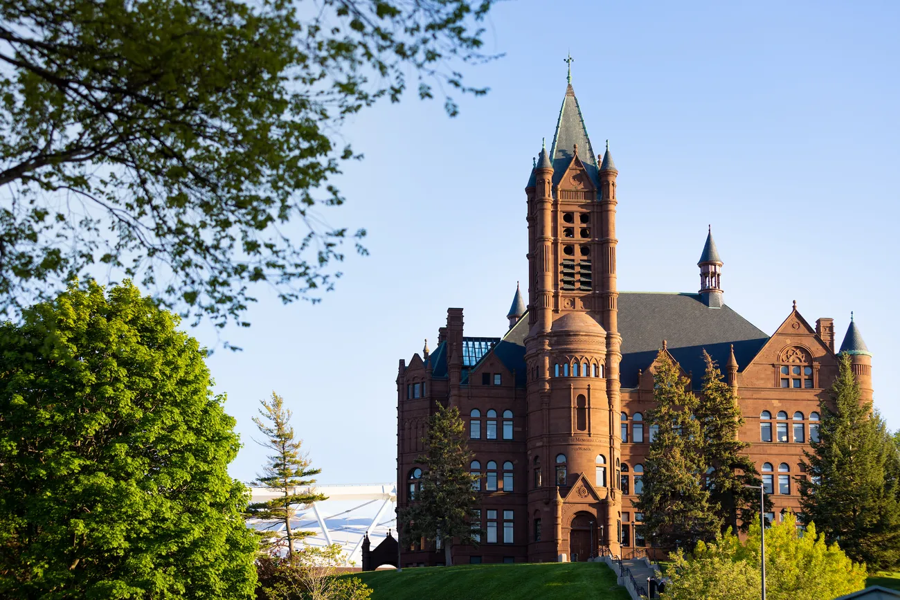 Crouse College surrounded by trees.