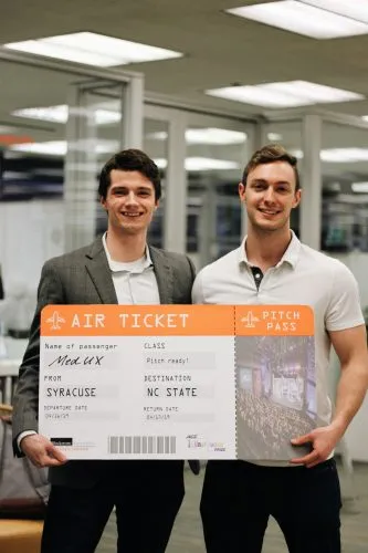 Quinn King and Alec Gillinder hold a ticket.