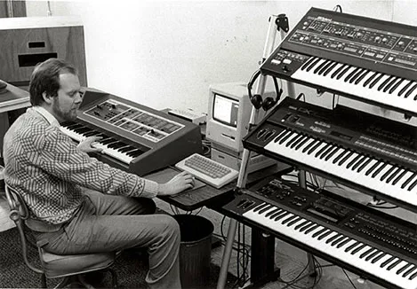 A person sits at a keyboard.