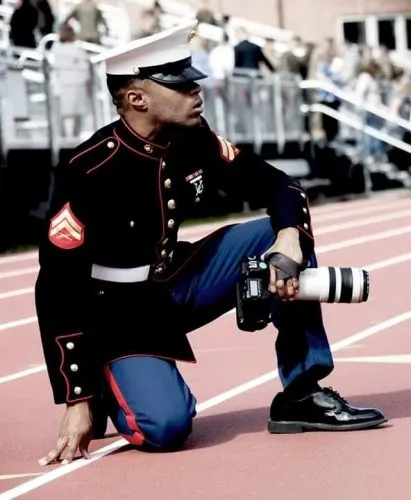 Adrian Weekly holds a camera on a track.