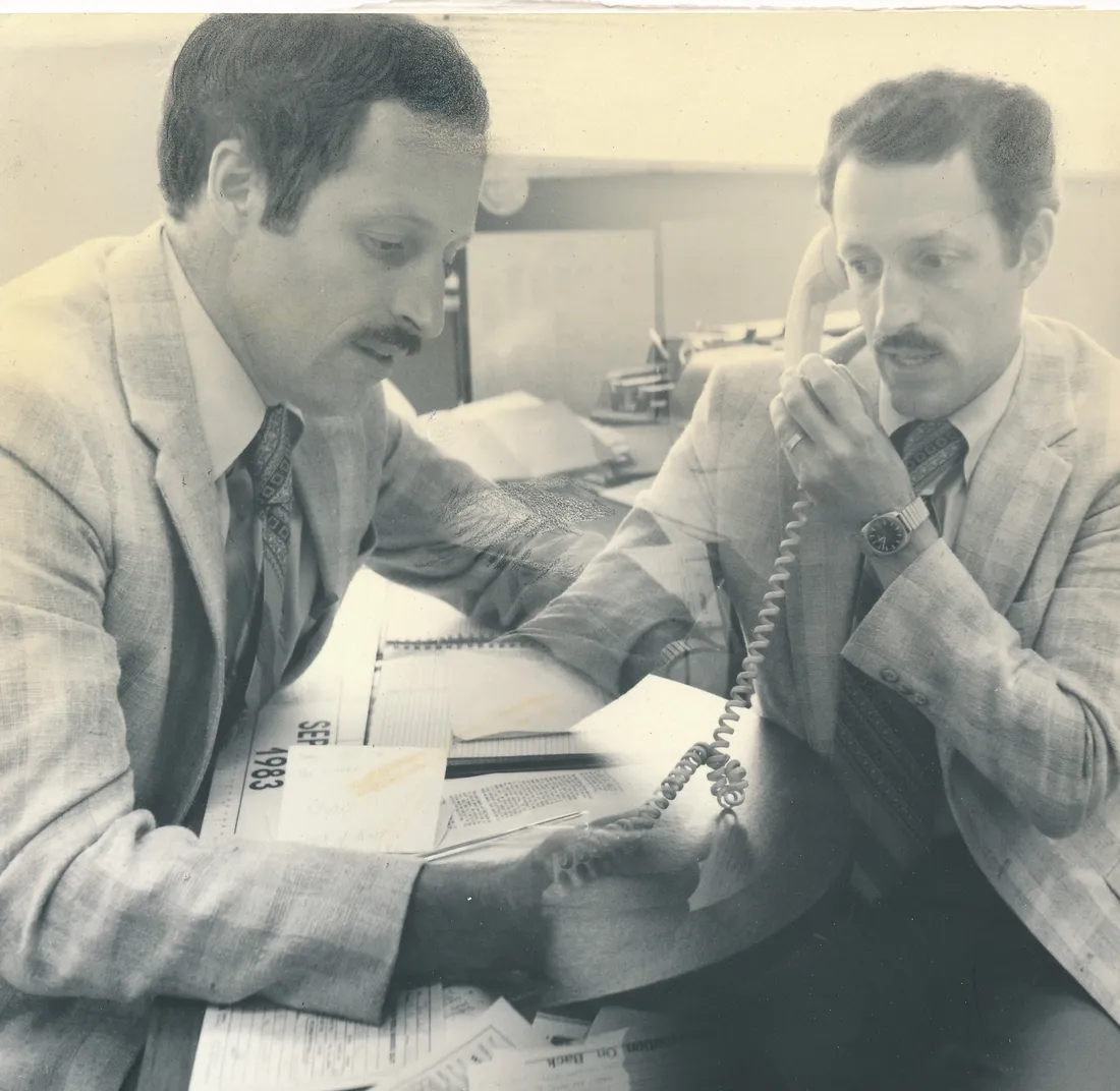 Jim Clark sitting at a desk and talking on the phone.