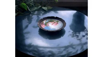 A painting of a bowl of water on a black table with flowers and foliage reflected in it.