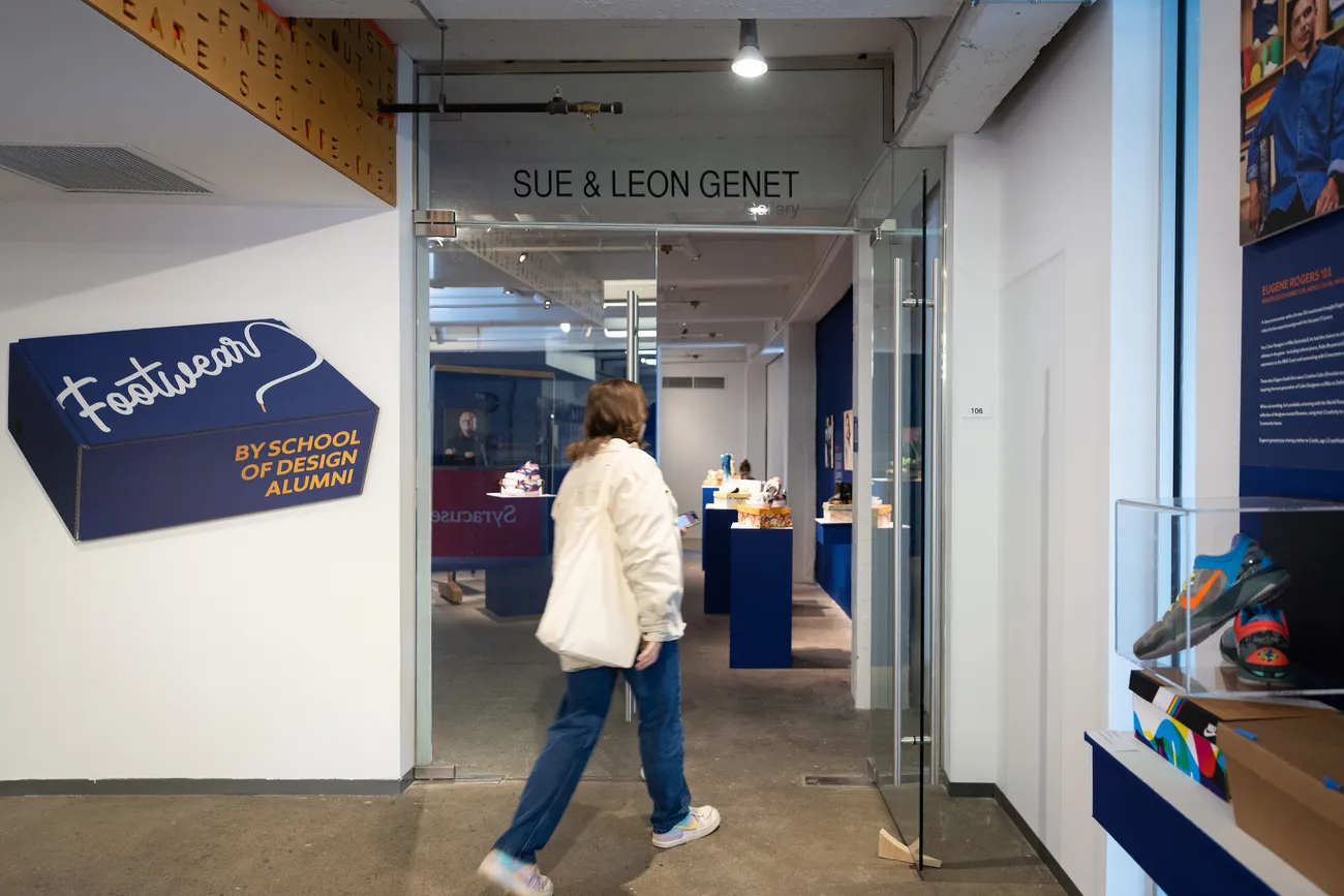 A person walks into the entrance of the Genet Gallery.