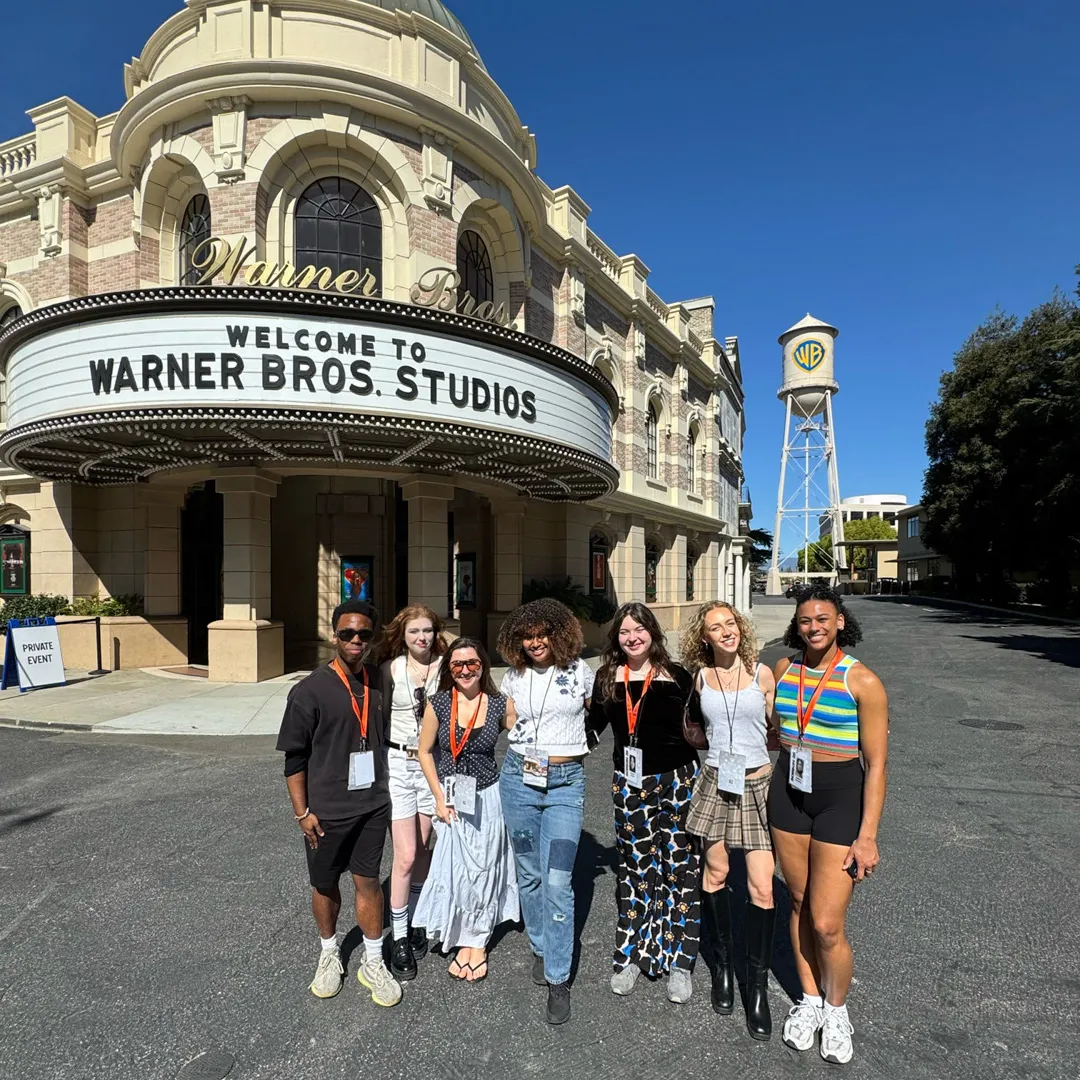 Students smile for the camera at Warner Bros. Studio.