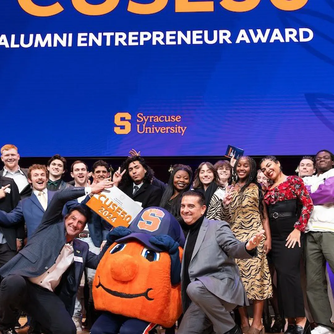 Some of the 2024 ’CUSE50 Alumni Award Winners pose on stage with Otto.