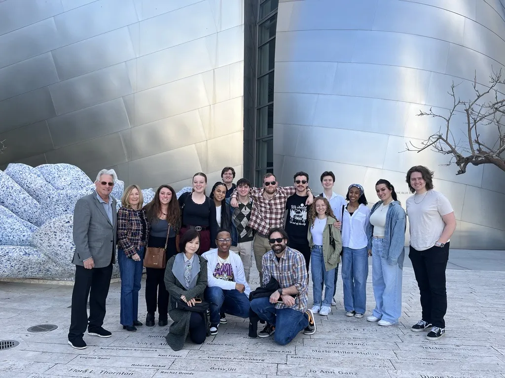 A group of students pose with Dennis and Nancy Gilbert in Los Angeles.