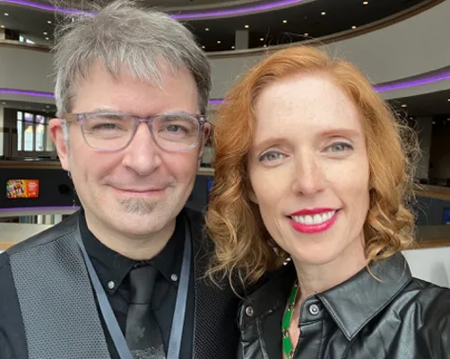 David Tarleton and Adria Dawn smiling and taking a selfie together.