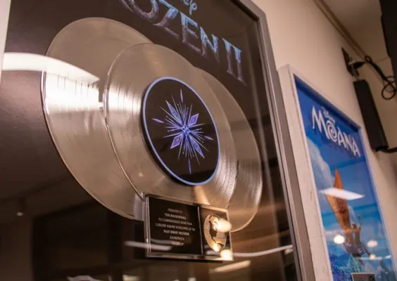 Platinum records and an award from the Disney movies “Frozen II” and “Moana,” donated by Tom MacDougall ’92.