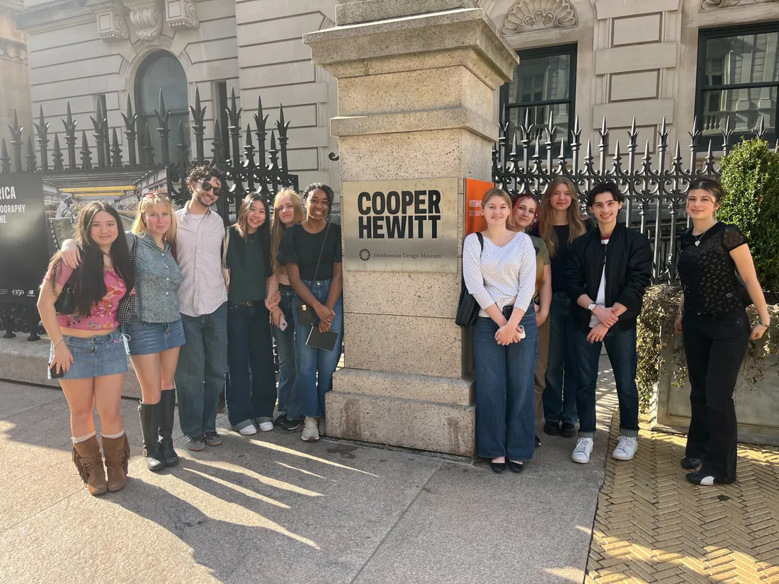Students pose next to the entrance to Cooper Hewitt, Smithsonian Design Museum.