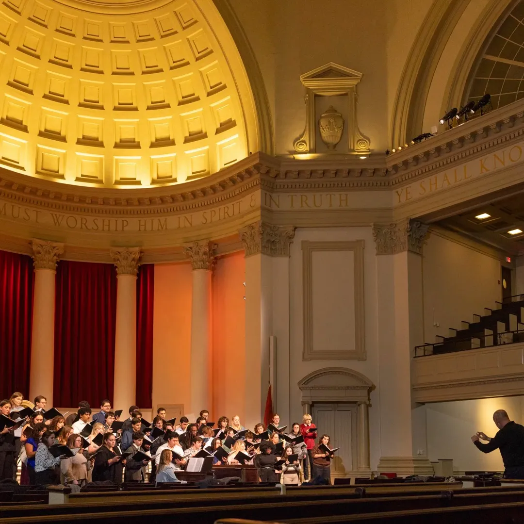 A choir sings in Hendricks Chapel.