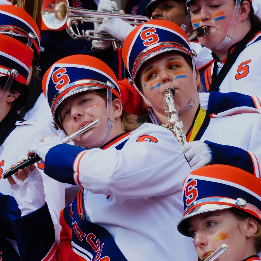 A person plays the piccolo.