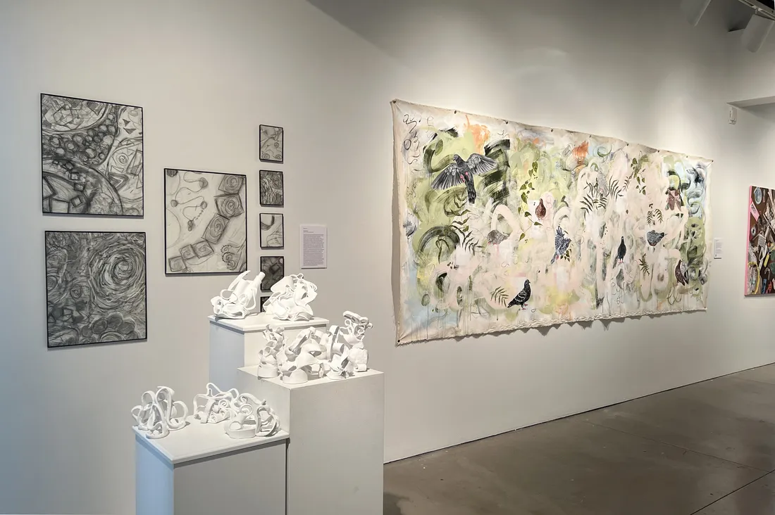 A gallery with artwork on the walls.