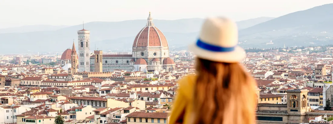 A person looks out over the city of Florence, Italy