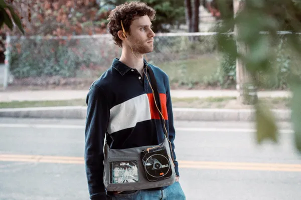 Dan Cohen walks down the street, listening to music.