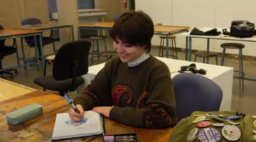 Paige Toglia draws on paper.