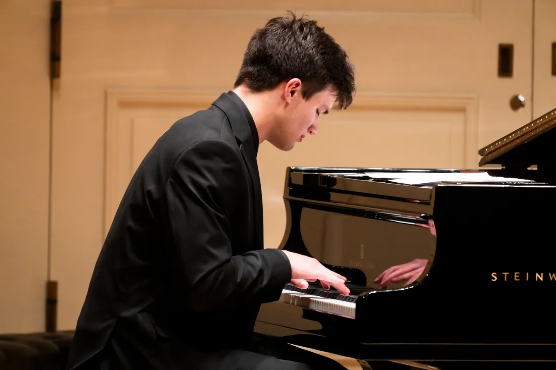 A person plays a piano.