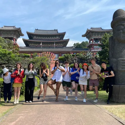 Students pose at Nakchunsa, a temple on Jeju Island.