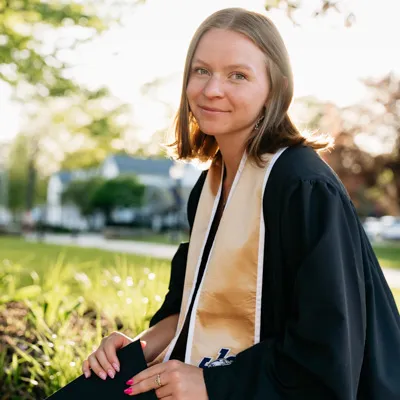 Headshot of Emelie Nonemaker in graduate attire.