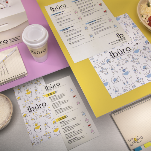 A coffee cup, notebook, and pieces of paper, all in a similar design.