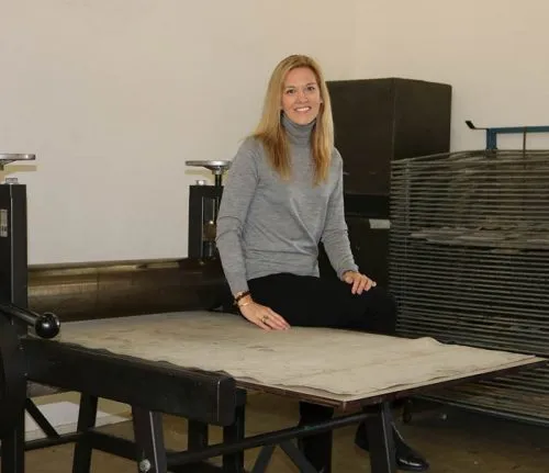 Holly Brown sits at a table.