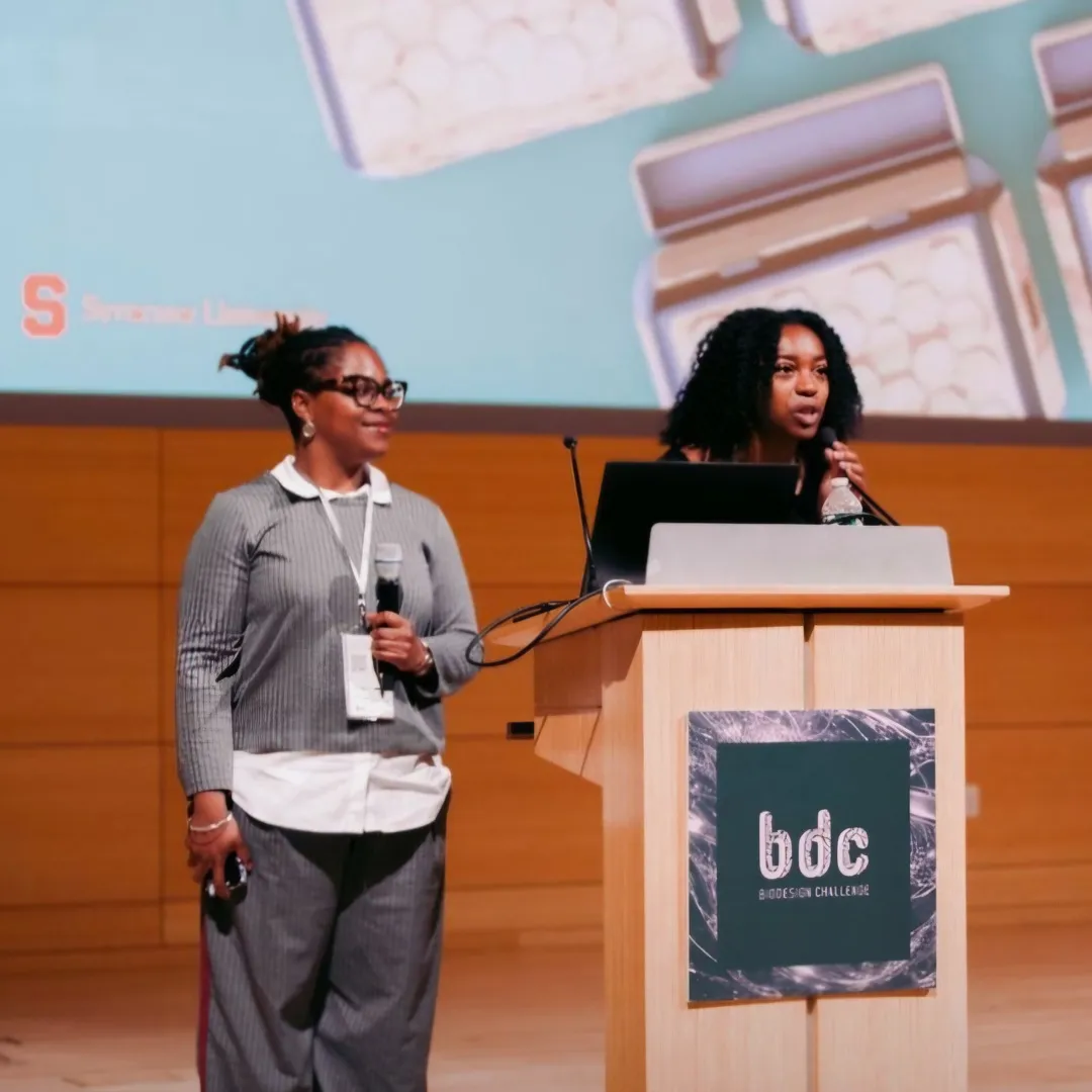 Karri Clay ’27 and Nia Griffin ’28 present on stage at the Biodesign Challenge Summit 2026.