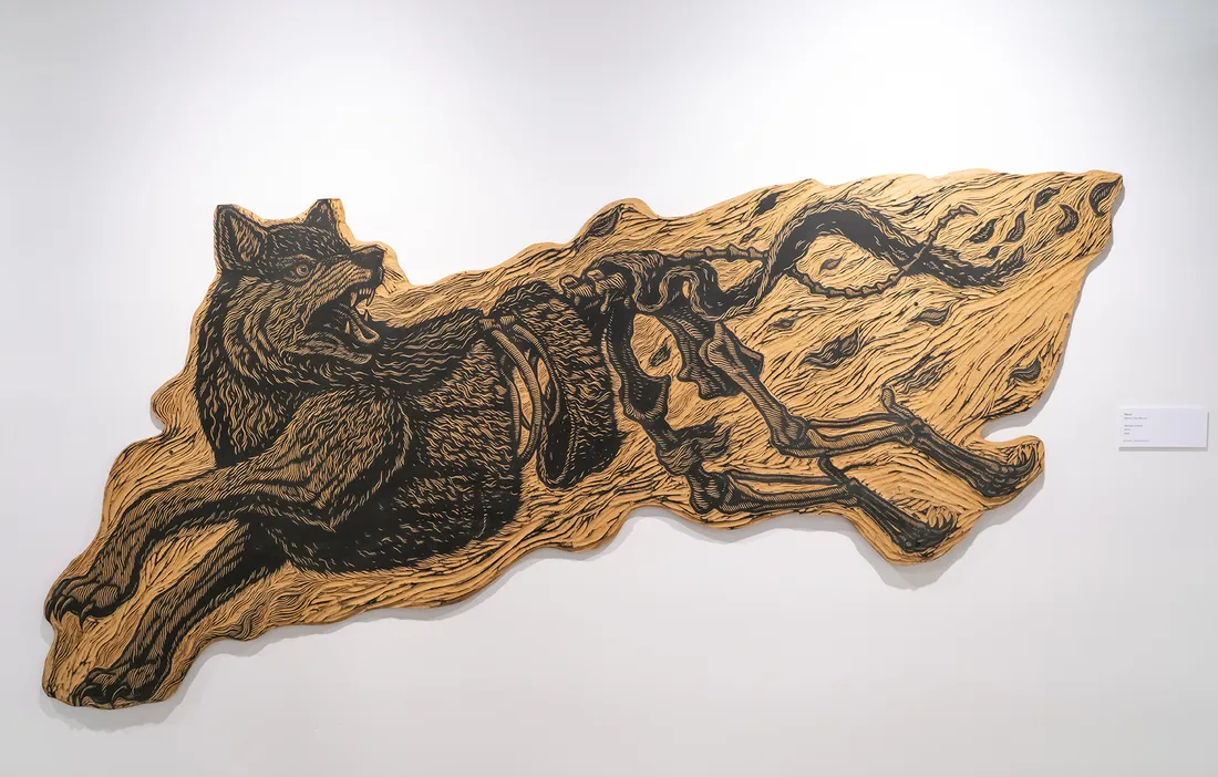 A print of a wolf running.